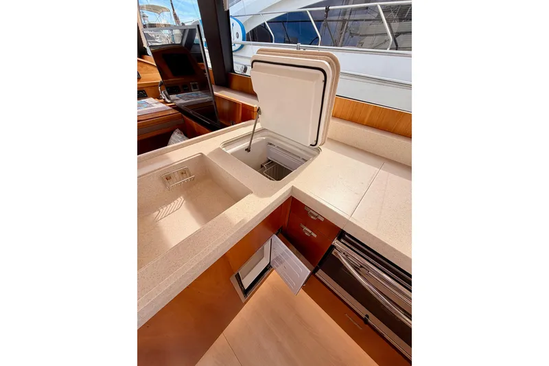 Slide: The Image of Luxurious kitchen area in 2016 Moody Decksaloon 54 yacht with modern amenities. - 56