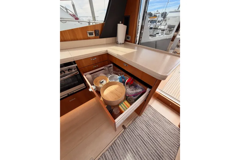 Slide: The Image of Modern kitchen interior of 2016 Moody Decksaloon 54 yacht with open drawer and countertop. - 61