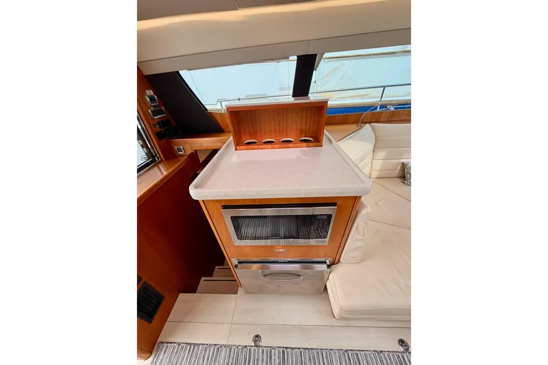 Slide: The Image of Luxurious interior of 2016 Moody Decksaloon 54 yacht with modern kitchen amenities. - 63