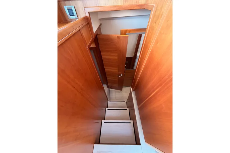 Slide: The Image of Staircase inside 2016 Moody Decksaloon 54 yacht with wooden interior design. - 65