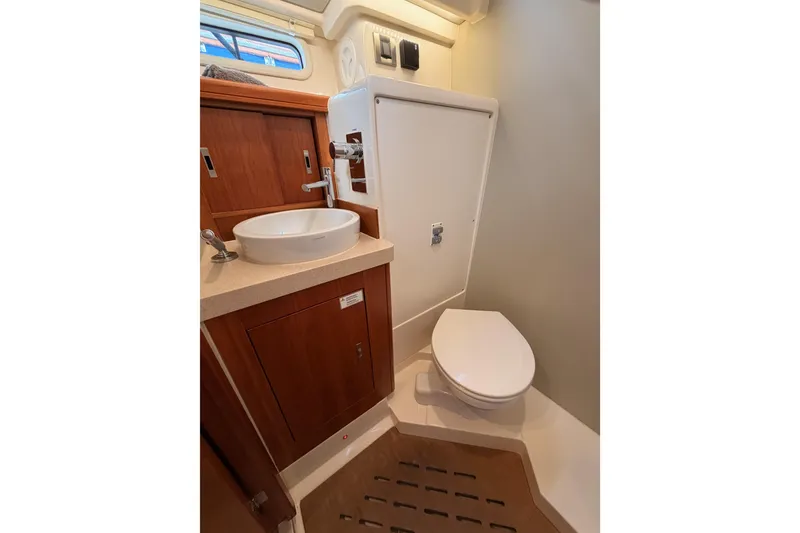 Slide: The Image of 2016 Moody Decksaloon 54 yacht bathroom with modern sink and toilet. - 68