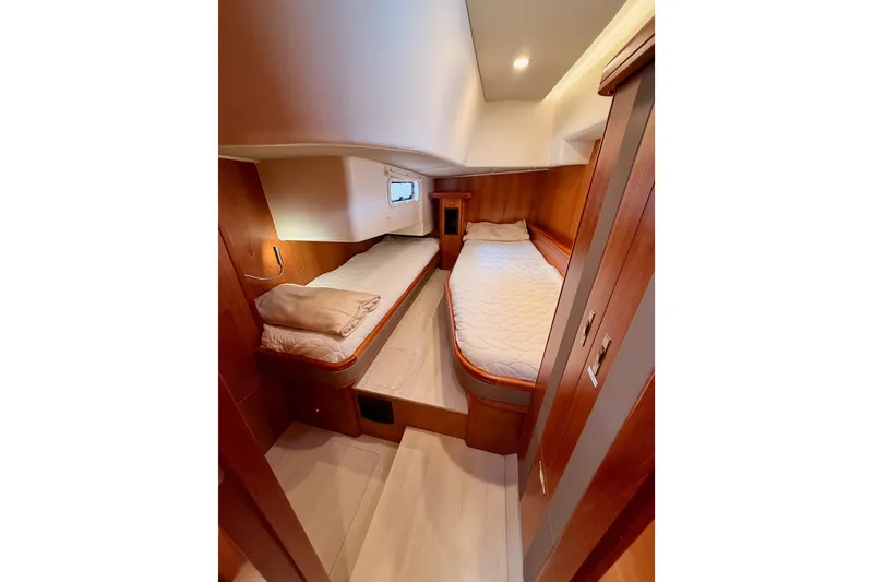 Slide: The Image of Cozy twin cabin in 2016 Moody Decksaloon 54 yacht with wooden interior. - 70