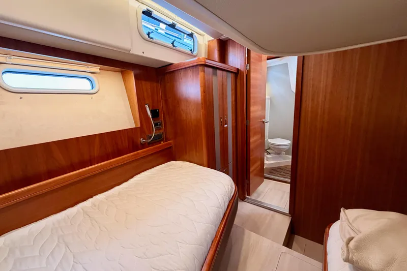 Slide: The Image of Cozy cabin interior of 2016 Moody Decksaloon 54 yacht with wooden finish and ensuite bathroom. - 72