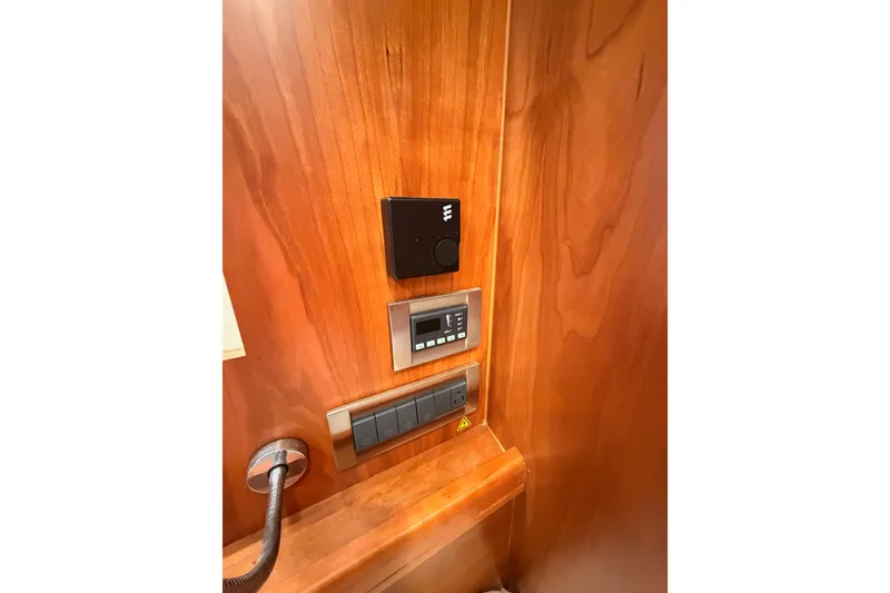 Slide: The Image of Control panel on wooden interior of 2016 Moody Decksaloon 54 yacht. - 73