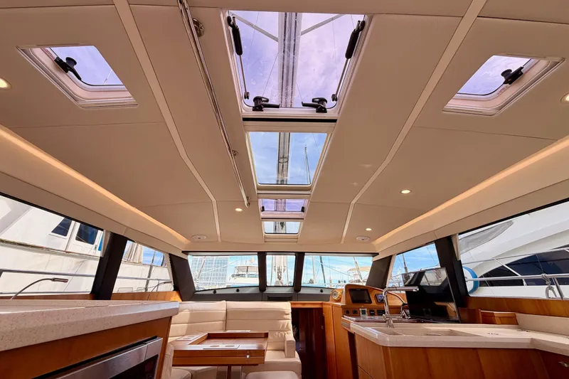 Slide: The Image of Luxurious interior of 2016 Moody Decksaloon 54 yacht with panoramic windows and modern design. - 74