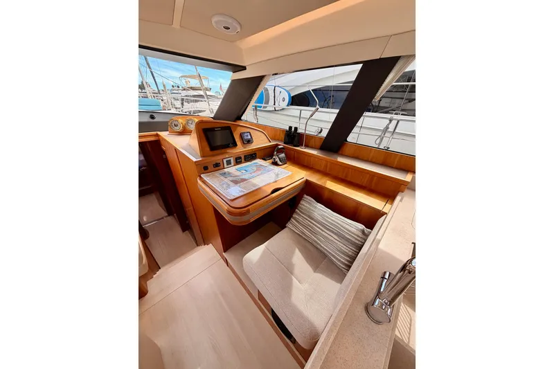Slide: The Image of Luxurious interior of 2016 Moody Decksaloon 54 yacht with navigation station. - 79