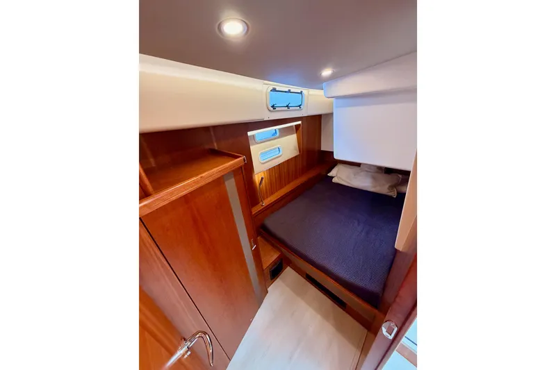 Slide: The Image of Cozy cabin interior of 2016 Moody Decksaloon 54 yacht with wooden finish. - 87