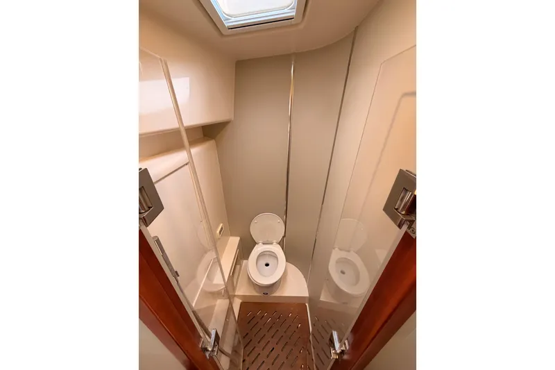 Slide: The Image of Bathroom interior of 2016 Moody Decksaloon 54 yacht, featuring modern design and skylight. - 92