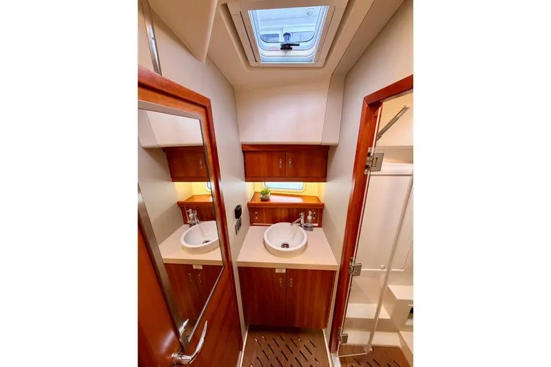 Slide: The Image of Luxurious bathroom interior of 2016 Moody Decksaloon 54 yacht with wooden finishes. - 95