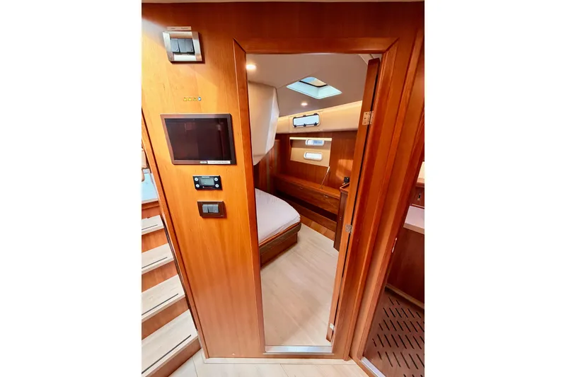 Slide: The Image of Interior of 2016 Moody Decksaloon 54 yacht, featuring wooden finishes and modern design. - 96