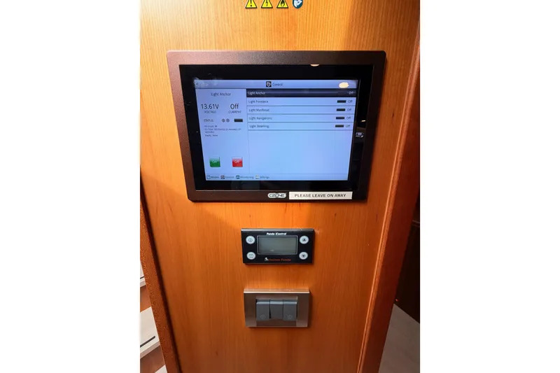 Slide: The Image of Control panel on a 2016 Moody Decksaloon 54 yacht, displaying light settings and voltage. - 97