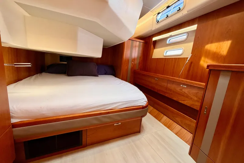 Slide: The Image of Luxurious cabin interior of 2016 Moody Decksaloon 54 yacht with wooden furnishings. - 99