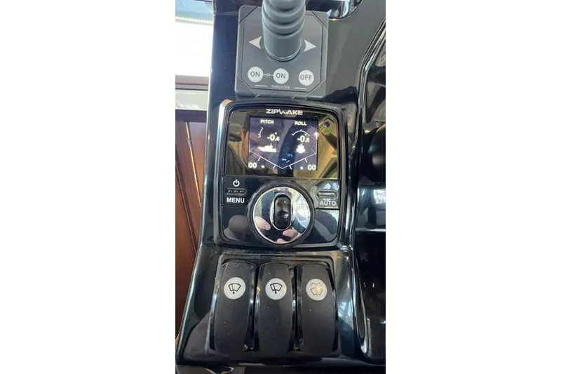 Slide: The Image of 2024 Jeanneau NC 895 Sport helm with modern controls and navigation display. - 3