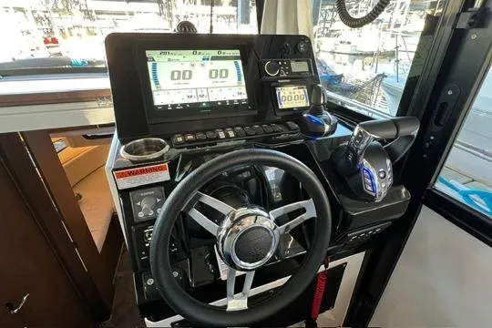Slide: The Image of Control panel of 2024 Jeanneau NC 895 Sport boat with Zipwake system. - 4