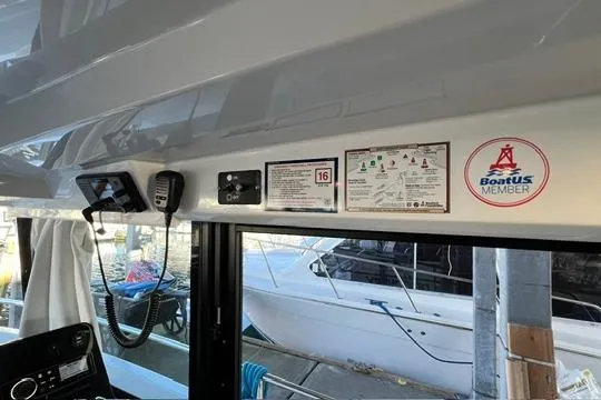 Slide: The Image of 2024 Jeanneau NC 895 Sport helm with modern controls and navigation display. - 5