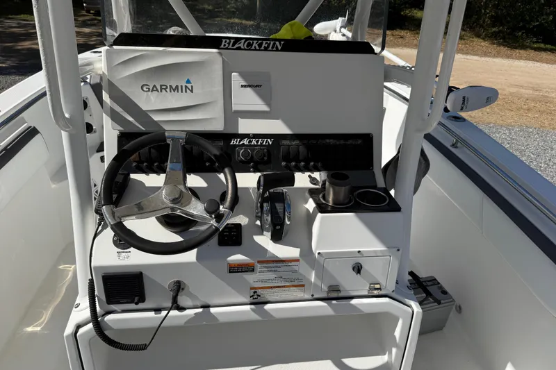 Slide: The Image of 2019 Blackfin 242 CC boat console with Garmin and Mercury controls. - 38