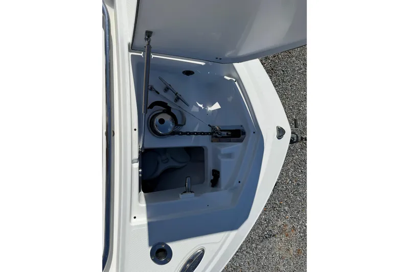 Slide: The Image of Open anchor compartment of 2019 Blackfin 242 CC boat, showing chain and storage. - 48