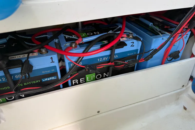 Slide: The Image of Lithium batteries in a 2019 Blackfin 242 CC boat, featuring RELiON LiFePO4 technology. - 52