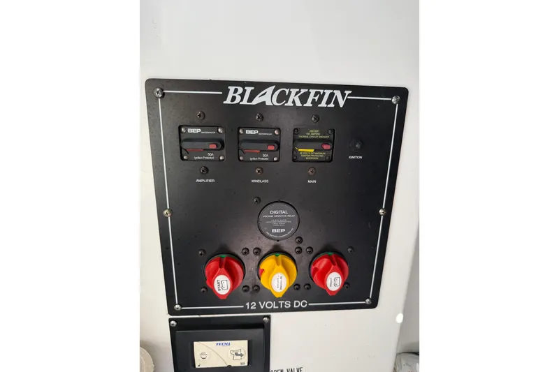 Slide: The Image of Control panel of 2019 Blackfin 242 CC boat with switches and circuit breakers. - 53