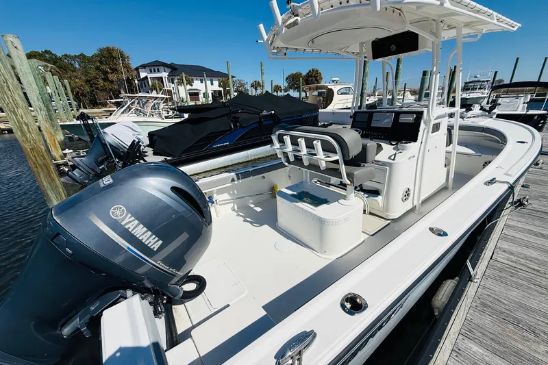 Slide: The Image of 2018 Parker 23SE Center Console boat docked with Yamaha outboard motor. - 5