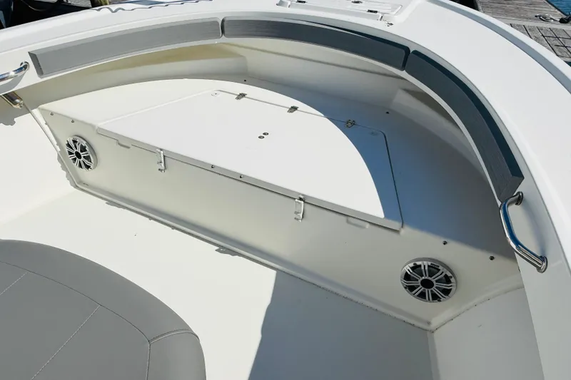 Slide: The Image of 2018 Parker 23SE Center Console boat interior with seating and speakers. - 8