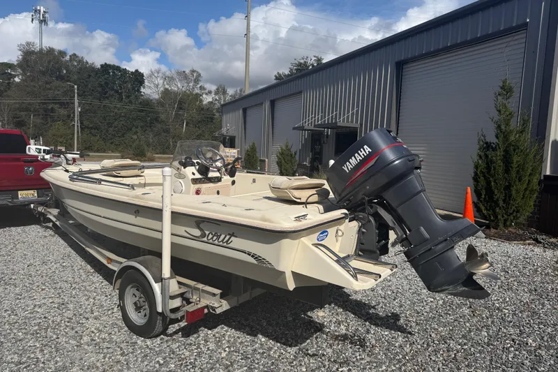 Slide: The Image of 1999 Scout 177 Sportfish boat with Yamaha outboard motor on trailer. - 3