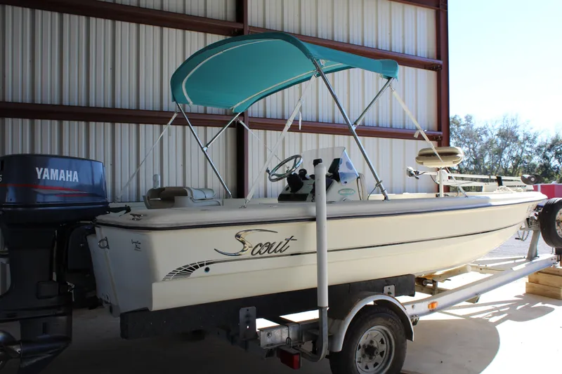 Slide: The Image of 1999 Scout 177 Sportfish boat with Yamaha motor in storage. - 8