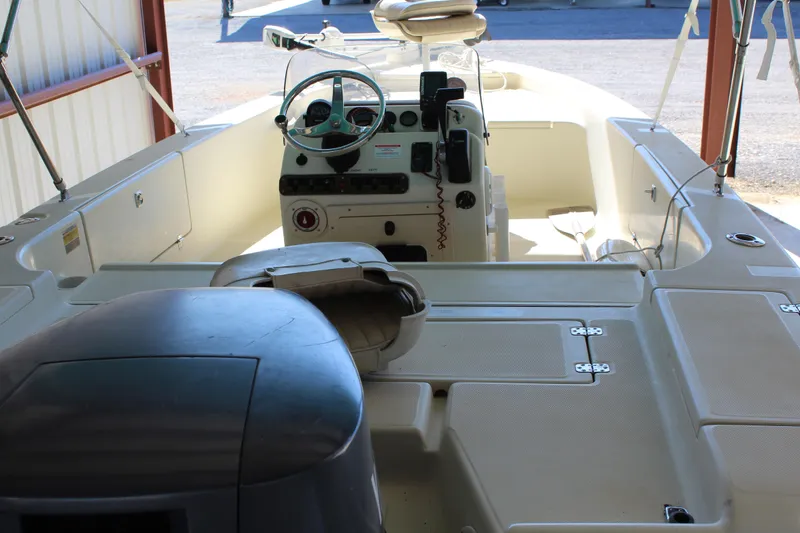 Slide: The Image of 1999 Scout 177 Sportfish boat interior with steering console and seating. - 9