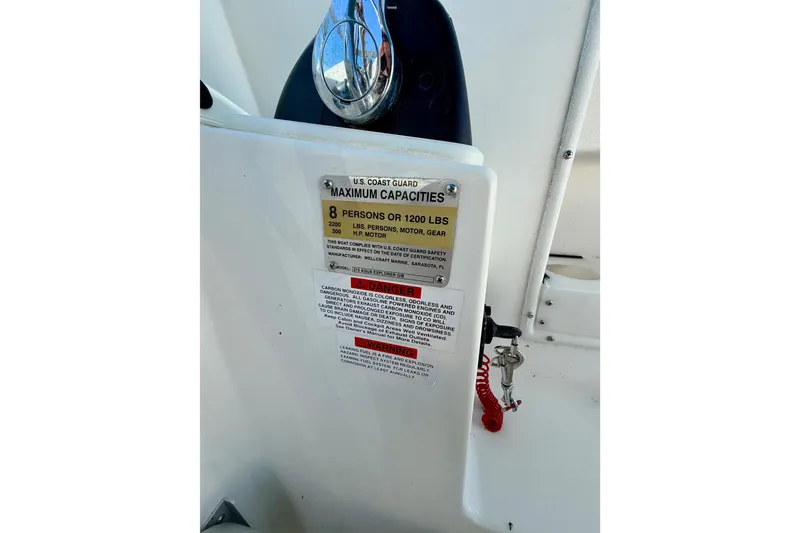 Slide: The Image of 2019 Aquasport 215 Explorer capacity plate, detailing maximum weight and passenger limits. - 12