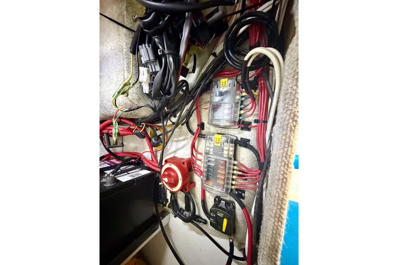 Slide: The Image of Electrical wiring and components inside a 2019 Aquasport 215 Explorer boat. - 15