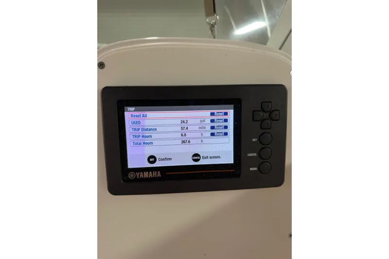 Slide: The Image of Yamaha display on 2019 Aquasport 215 Explorer showing trip data and settings. - 18