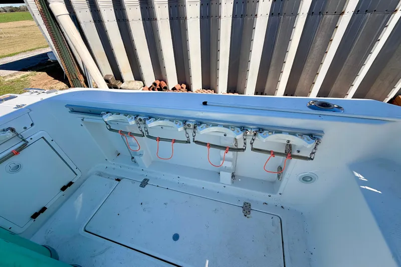 Slide: The Image of 2019 Aquasport 215 Explorer boat interior with storage compartments and safety equipment. - 6