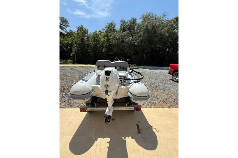 Slide: The Image of 2026 Highfield Classic 310 FCT inflatable boat on trailer, outdoors. - 4