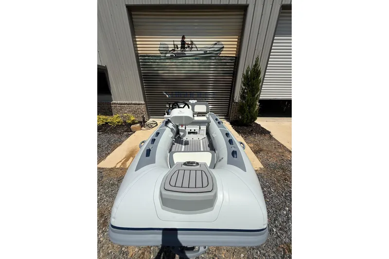 Slide: The Image of 2026 Highfield Classic 340 FCT boat displayed outdoors, showcasing sleek design and modern features. - 4