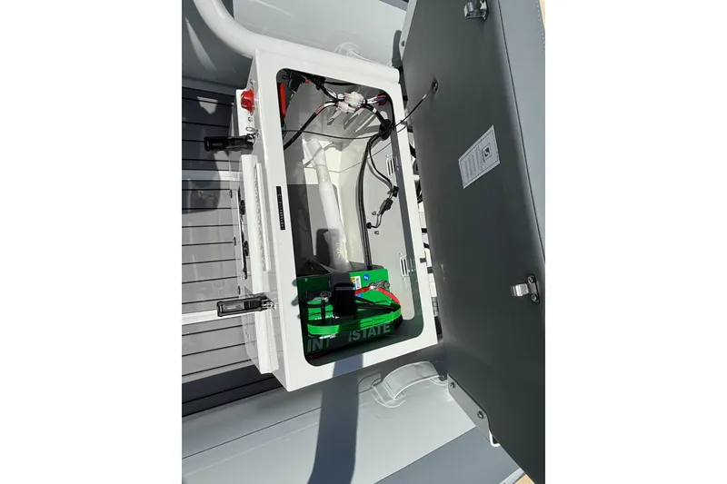 Slide: The Image of 2026 Highfield Classic 340 FCT boat battery compartment with wiring and components. - 6