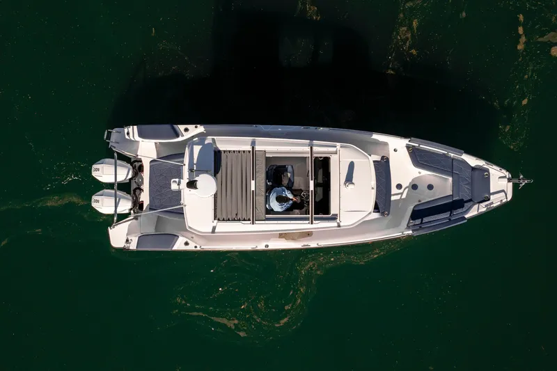Slide: The Image of Top view of 2024 Axopar 29 XC Cross Cabin boat on water. - 10