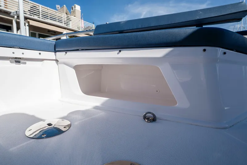 Slide: The Image of 2024 Axopar 29 XC Cross Cabin interior seating and storage detail. - 40