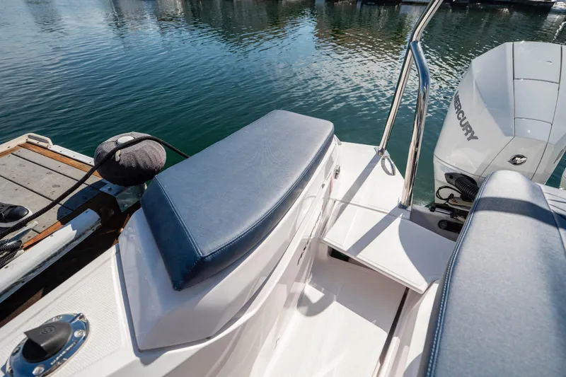 Slide: The Image of 2024 Axopar 29 XC Cross Cabin boat with Mercury engine at dockside. - 48