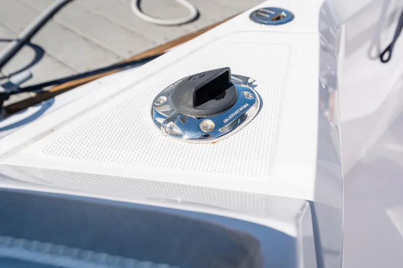 Slide: The Image of 2024 Axopar 29 XC Cross Cabin deck detail with chrome fittings. - 53