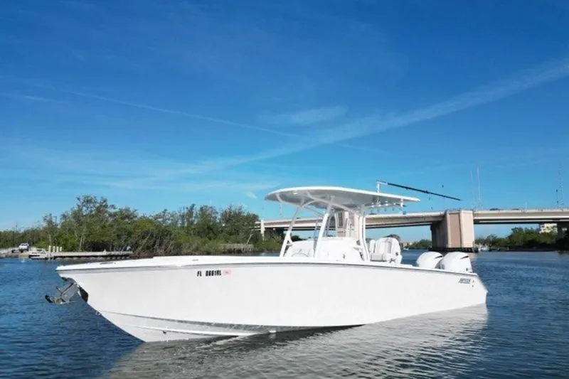 The Image of 2018 Jupiter 30 HFS boat on calm water under clear blue sky. - 0