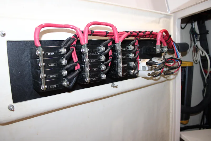 Slide: The Image of Electrical panel with circuit breakers and wiring in a 2018 Jupiter 30 HFS boat. - 10