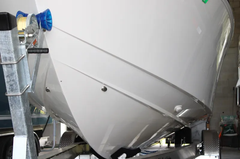 Slide: The Image of 2018 Jupiter 30 HFS boat on trailer, close-up of hull and winch. - 14