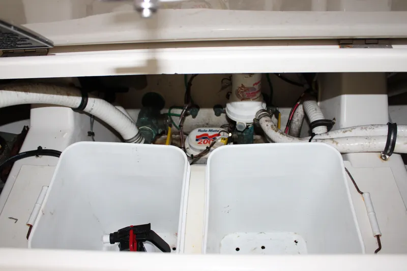 Slide: The Image of 2018 Jupiter 30 HFS boat interior showing plumbing and storage compartments. - 16