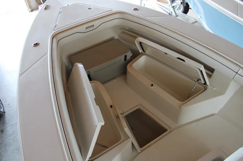 Slide: The Image of 2018 Jupiter 30 HFS boat interior with open storage compartments. - 17