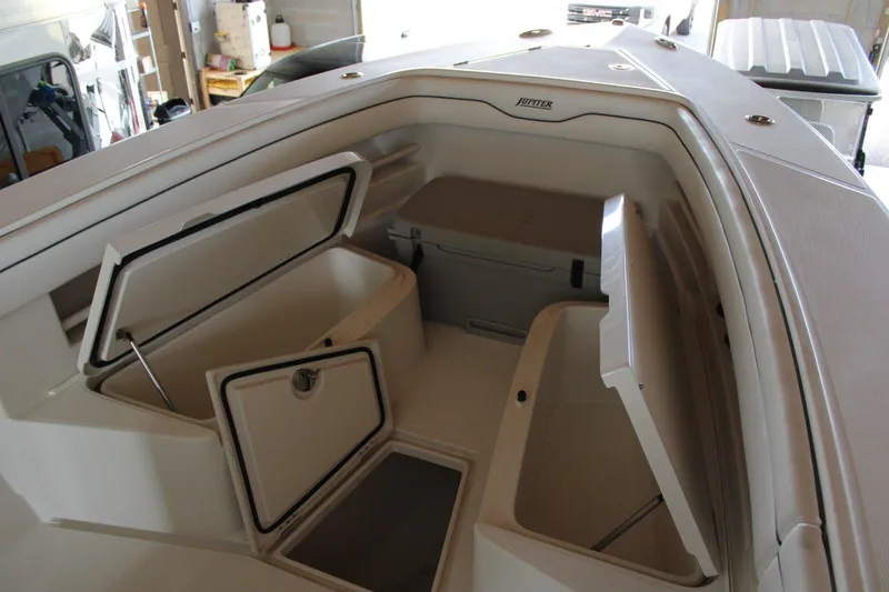 Slide: The Image of 2018 Jupiter 30 HFS boat interior with open storage compartments. - 19