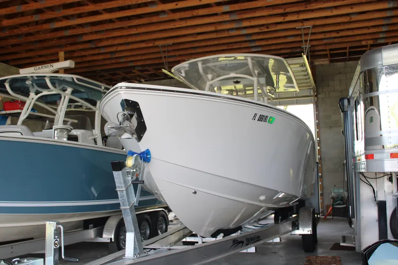 Slide: The Image of 2018 Jupiter 30 HFS boat on trailer in storage facility. - 2