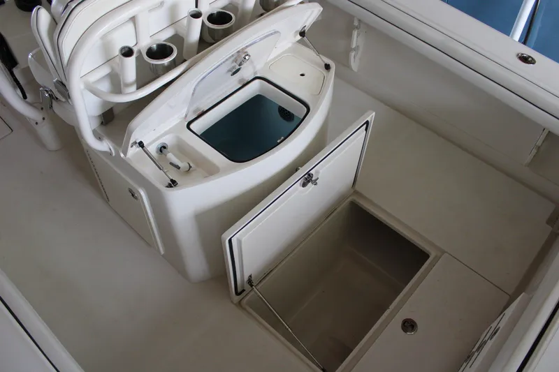 Slide: The Image of 2018 Jupiter 30 HFS boat interior with storage compartments and rod holders. - 21