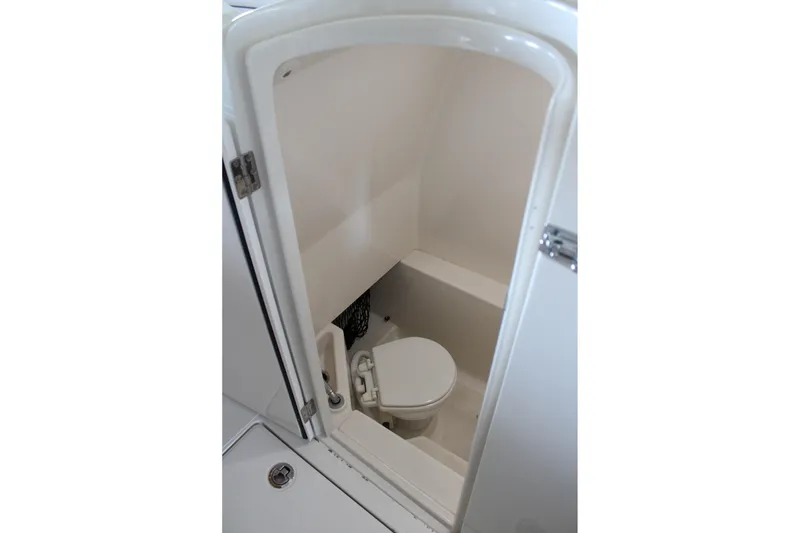 Slide: The Image of Compact marine toilet inside 2018 Jupiter 30 HFS boat cabin. - 22