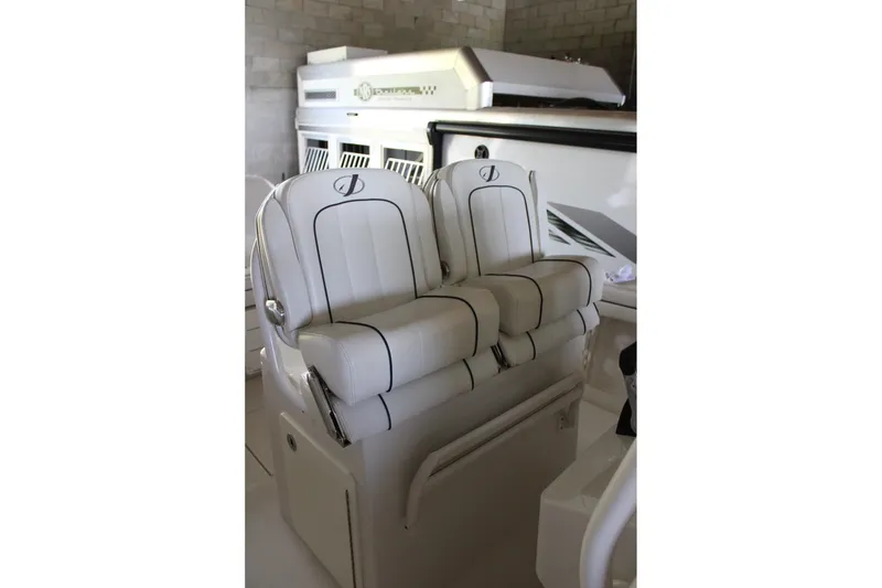 Slide: The Image of 2018 Jupiter 30 HFS boat interior with luxurious white seating and sleek design. - 23