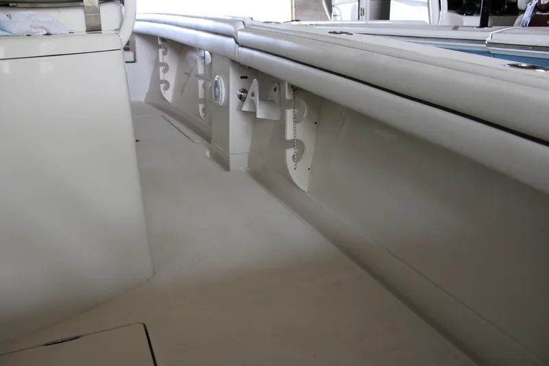 Slide: The Image of 2018 Jupiter 30 HFS boat interior with sleek white seating and storage compartments. - 25